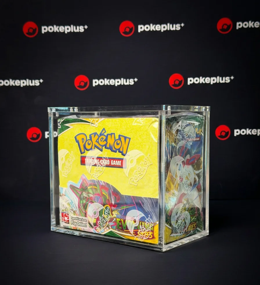 A sealed Pokémon Evolving Skies Booster Box in a clear acrylic case, photographed in front of a pokeplus backdrop.
